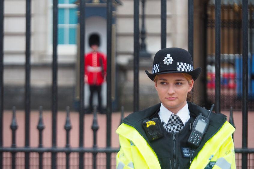 Police woman with police radio